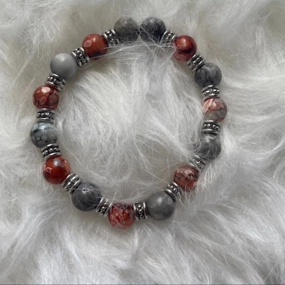 A cute orange and black kid bracelet or for women too - Picture 2 of 2